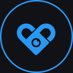Fansly logo which is a blue circle with a blue heart in it with a hole in the middle